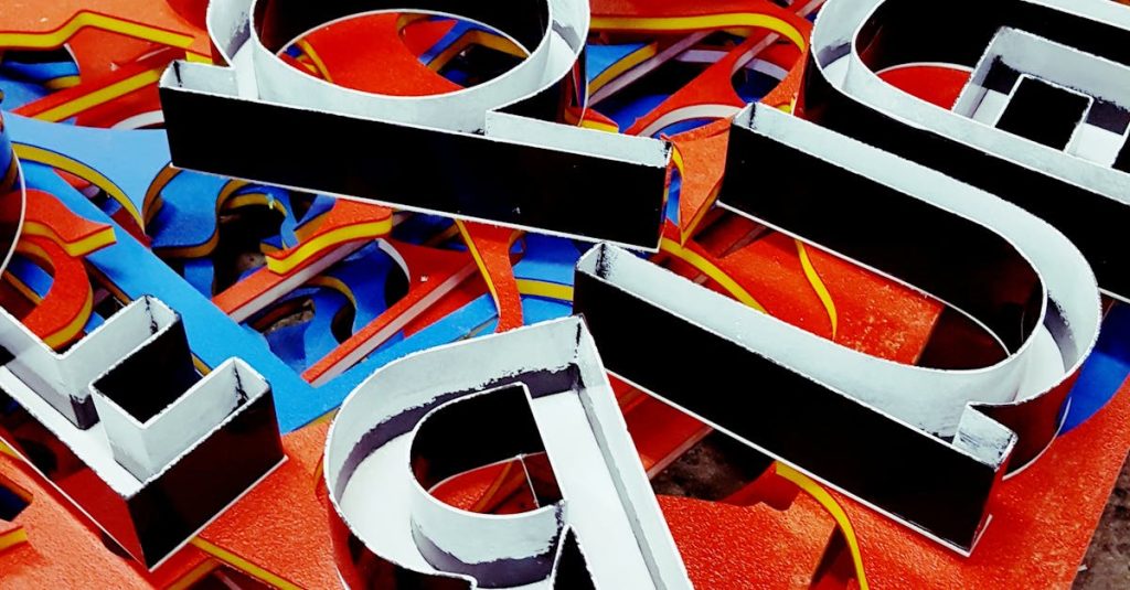 Vibrant neon letters arranged artistically, showcasing a unique signage design.